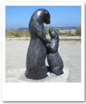 Mother otter and pup statue
